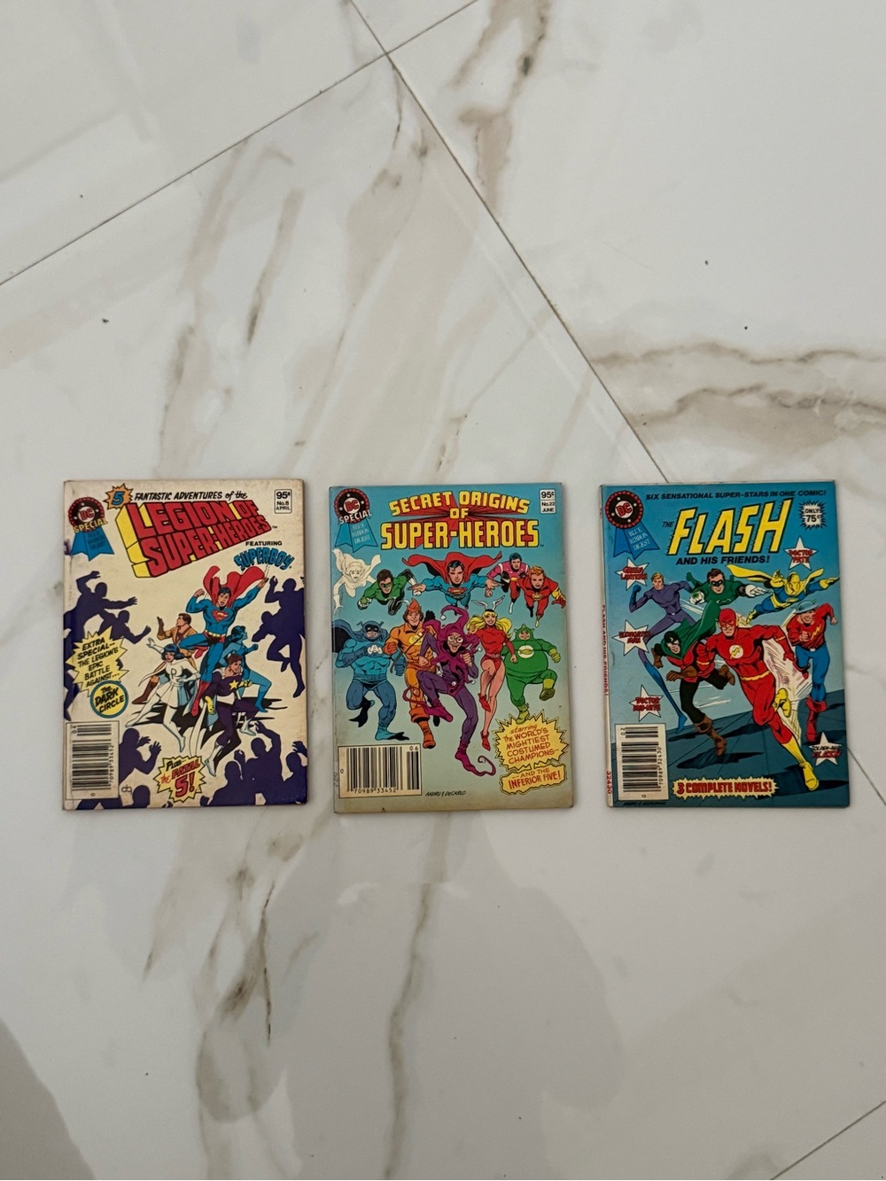 DC Secret Origins of Super‑Heroes Comic with Bright Blue & Red Cover